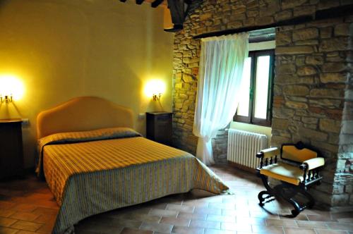 Кровать или кровати в номере Agriturismo Popolano Di Sotto
