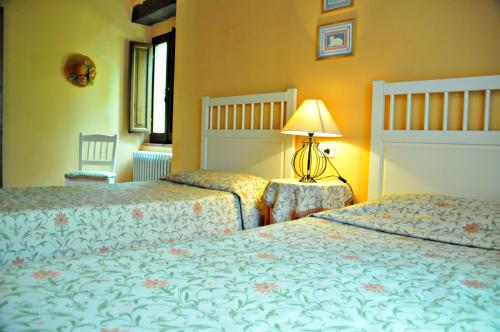 Кровать или кровати в номере Agriturismo Popolano Di Sotto