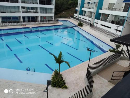 an overhead view of a large swimming pool in a building at Apartasol San Jerónimo in San Jerónimo