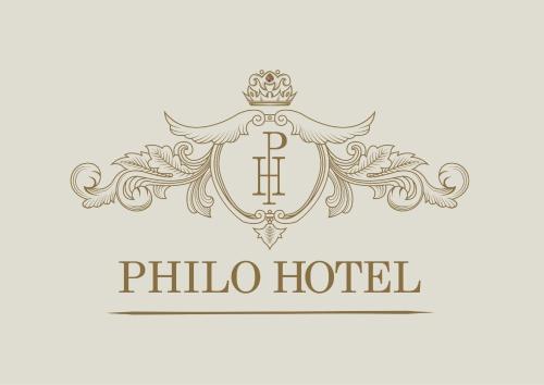 a shield with a crown and a pillar hotel logo at Philo Hotel in Cairo