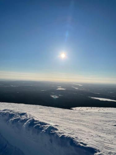 a view from the top of a snow covered slope at Yllästölli 2 D, Äkäslompolo in Kolari