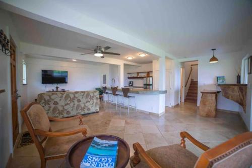a living room with a couch and a table at Hana Homestead in Hana