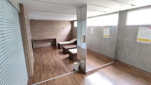 a hospital room with a bench and a shower at S4 Hotel - Studio particular - Apt 620 - Águas Claras in Brasilia