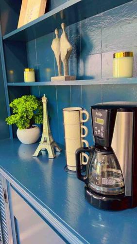 a counter with a coffee maker on a blue counter top at Bonito descanso LAX 10 min SOFI 5 min in Hawthorne
