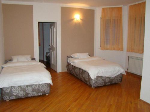 Ένα ή περισσότερα κρεβάτια σε δωμάτιο στο Guest House Zamak