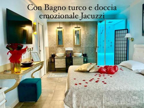 a bedroom with a bed with red rose petals on it at Dimora di Charme Rooms & Apartments in Peschiera del Garda