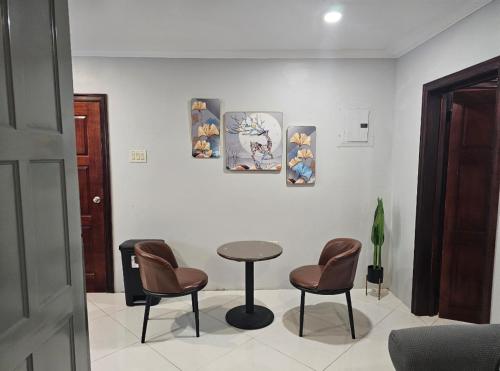 a room with a table and two chairs and a table at Secret Hideaway in Ocho Rios