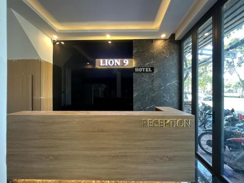 a store front with a sign that says how reception at LION 9 HOTEL in Can Tho