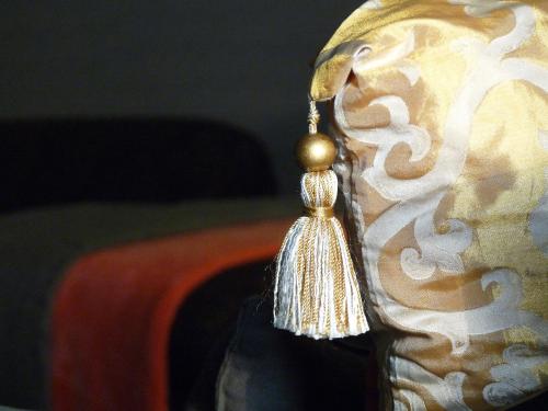 a close up of a tassel on the side of a mask at Golden Treasure Deluxe in Münster