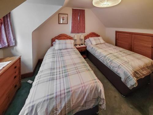 Un pat sau paturi într-o cameră la South Lodge