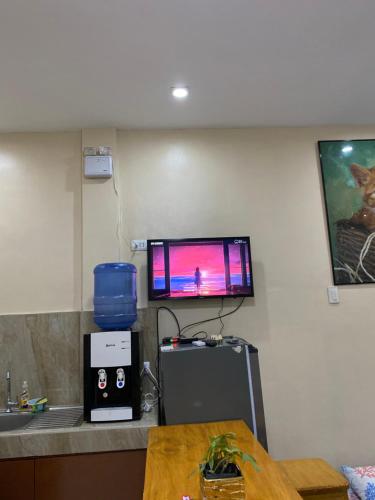 a room with a counter with a tv on the wall at Studio Type Apartment 2 with Pool and Tennis Court in Alburquerque