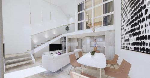 a living room with a white table and chairs at SUITE MAJESTIEUSE T2T3 au carré cathédrale en HYPER-CENTRE Saint Denis in Saint-Denis