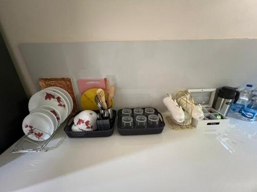 a kitchen counter with dishes and other items on it at Luxury 3bhk villa (mere bebe da villa)@gopal nagar in Jalandhar