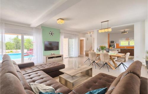 a living room with a couch and a table at Villa Lena in Sarići