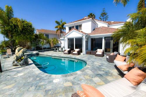 a swimming pool in the backyard of a house at Private Beach front 4bed 4bath pool and spa house in San Diego