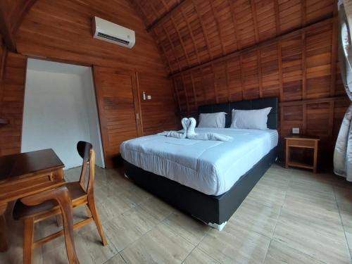 Ένα ή περισσότερα κρεβάτια σε δωμάτιο στο Les Chalets Pecatu
