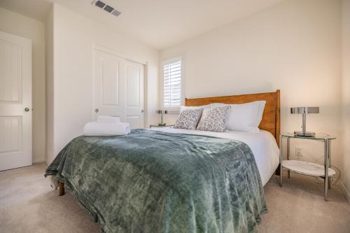 a bedroom with a large bed with a green blanket at Peaceful 4BR Home With Mountain View in Ormand