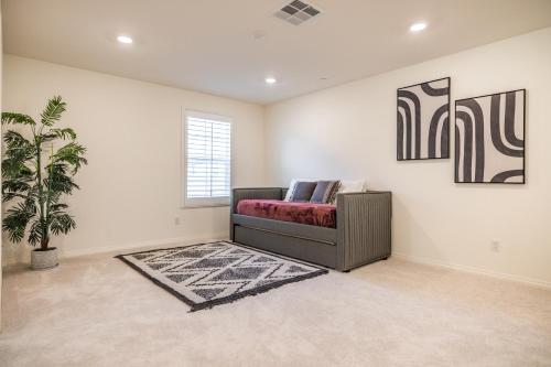 a living room with a couch and a rug at Peaceful 4BR Home With Mountain View in Ormand