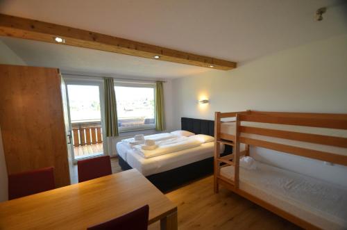 Postel nebo postele na pokoji v ubytování Deluxe Studio Kaprun by All in One Apartments