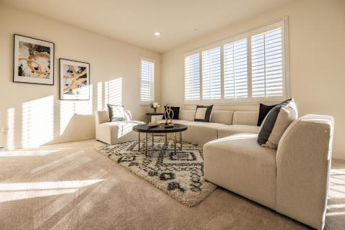 a living room with a couch and a table at Peaceful 4BR Home With Mountain View in Ormand