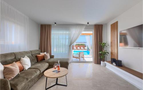 a living room with a couch and a table at Villa Veduta in Pula