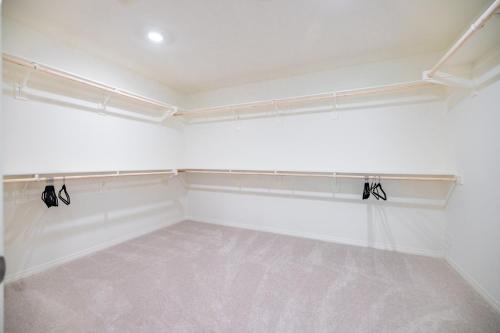an empty room with white walls and a white floor at Peaceful 4BR Home With Mountain View in Ormand