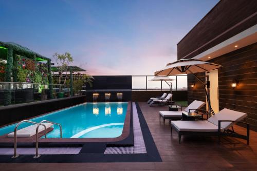 a swimming pool on top of a building at Fortune Ranjit Vihar, Amritsar- Member ITC's hotel group in Amritsar