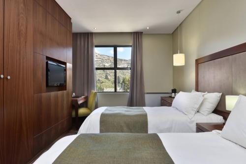 Katil atau katil-katil dalam bilik di Protea Hotel by Marriott Clarens