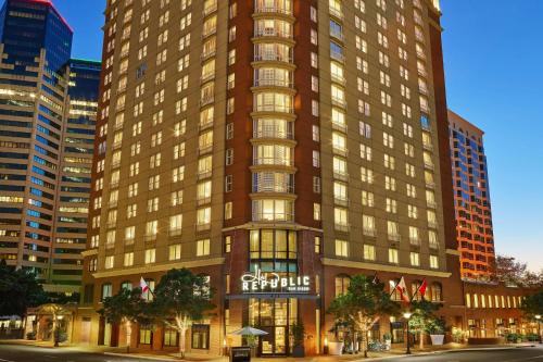 a tall brown building with a sign on it at Hotel Republic San Diego, Autograph Collection in San Diego