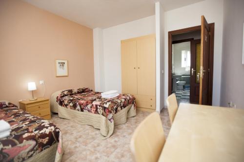 Ένα ή περισσότερα κρεβάτια σε δωμάτιο στο Apartamento Turístico La Ribera del Marco