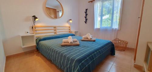 Un pat sau paturi într-o cameră la Casa TRAMUNTANA - Las Golondrinas