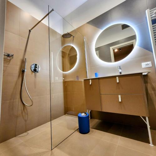 a bathroom with a shower and a mirror at b&b marconi 49 in Bologna