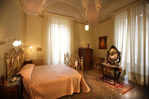 Postel nebo postele na pokoji v ubytování Historical Suites VVM