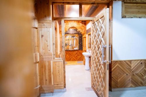 an open door to a bathroom in a house at Norvin Homes in Shimla
