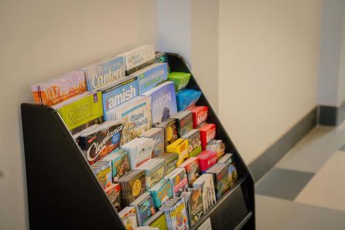 a shelf filled with different types of cereal at Royal Inn & Suites in Akron