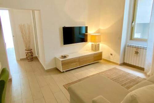 a living room with a flat screen tv on a wall at casa Re Manfredi 12 in Bari