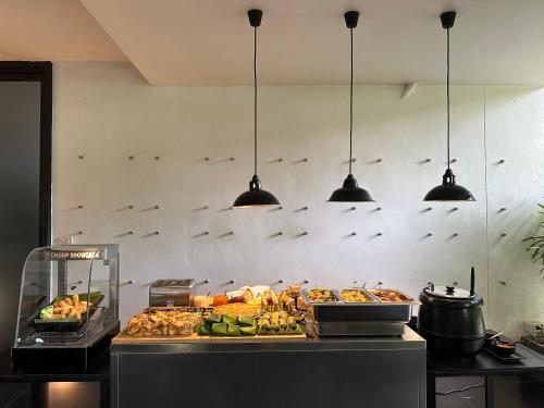 a buffet line with many different types of food at BED Changkian - Adults Only in Chiang Mai