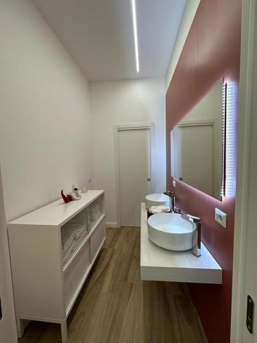 a bathroom with a sink and a mirror at Napoli centro - Di&da guest house in Naples