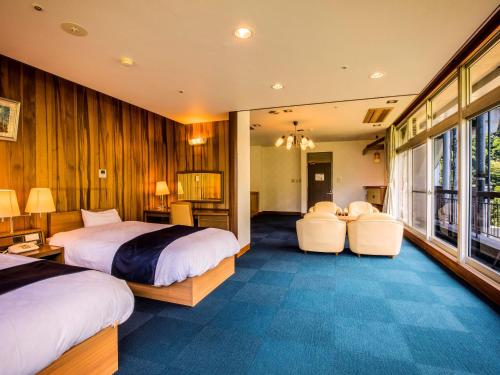 Tempat tidur dalam kamar di Yukai Resort Premium Unazuki Grand Hotel