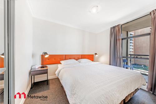 a bedroom with a large bed and a window at MetaWise Sydney CBD Haymarket 2Bed Apartment 1506 in Sydney