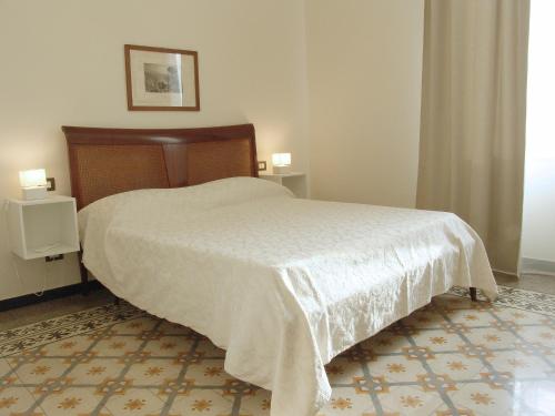 Giường trong phòng chung tại Residenza Cavour - Appartamento AGAVE
