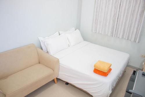Postel nebo postele na pokoji v ubytování Vitasolo Hometel & Suite