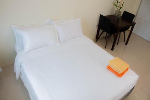 Postel nebo postele na pokoji v ubytování Vitasolo Hometel & Suite