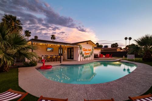 a swimming pool in the backyard of a house at Gorgeous 4-bed home with Golf, Pool, & Hot Tub! in Phoenix