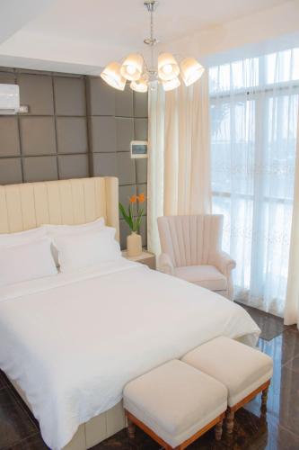 Postel nebo postele na pokoji v ubytování Vitasolo Hometel & Suite