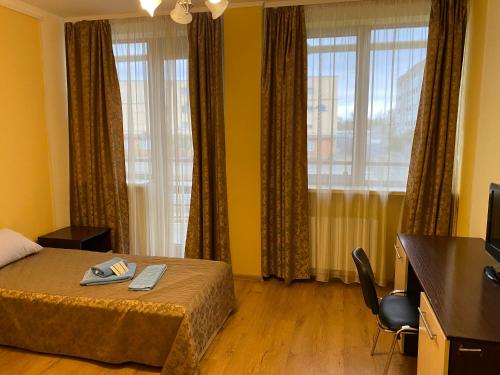 Postel nebo postele na pokoji v ubytování Hotel Obolon-Arena