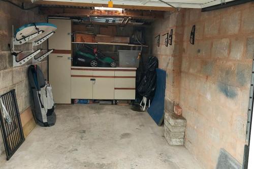 a garage with a car inside of it at High Tide in Braunton