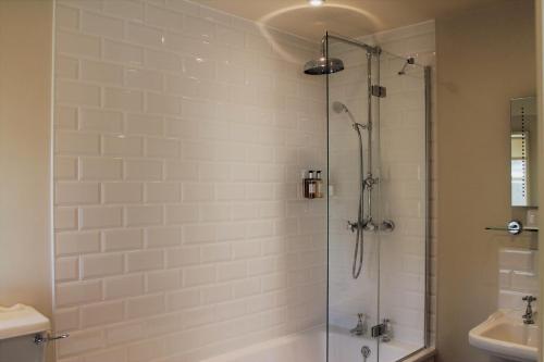 a bathroom with a shower and a sink at The Ship Inn in Rye
