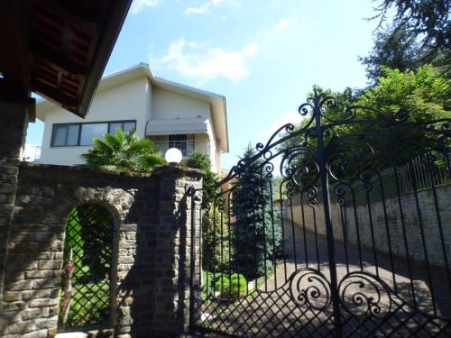 a black wrought iron fence in front of a house at Stanze Degli Aceri in Murazzano