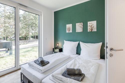a bedroom with a bed and a large window at JAMA Natur Pur, Freies Parken, Gruppe&Familie in Erlangen